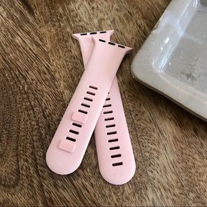 Pink Apple Watch band.